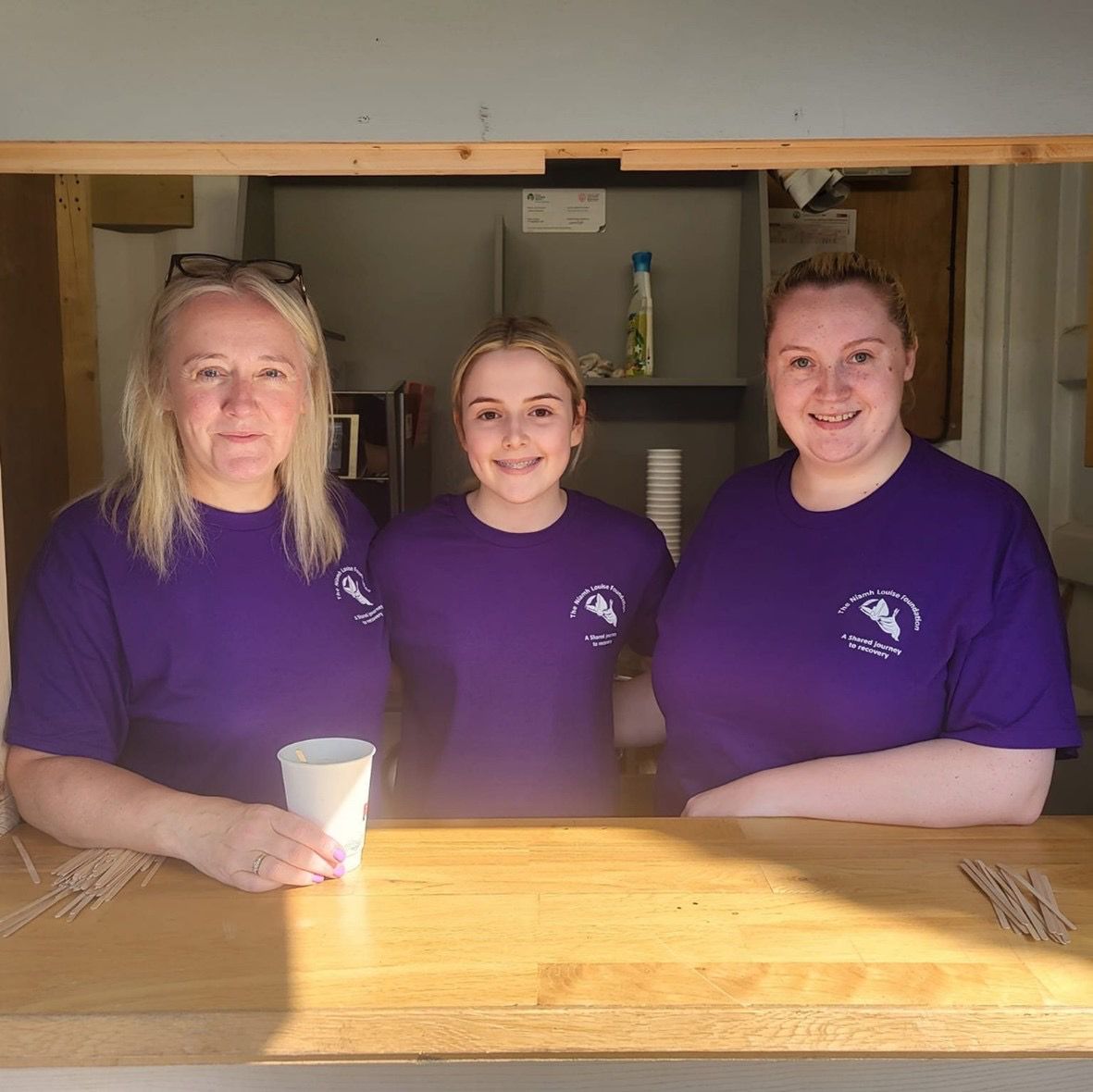 Niamh Louise Foundation volunteers in purple t-shirts at the resource centre