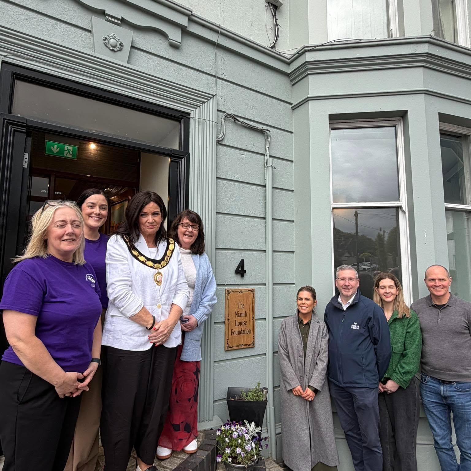 Niamh Louise Foundation team welcoming visitors at the front door of the resource centre